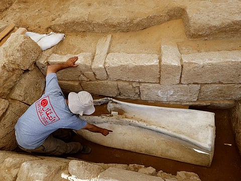 Fadel Al A'utul, an expert from the French School of Biblical and Archeological Research, works in a Roman-era cemetery in Gaza, July 23, 2023. 