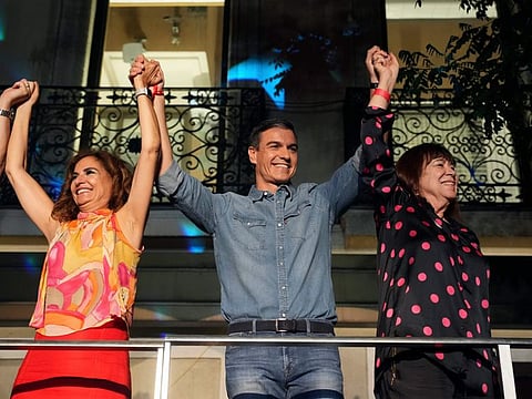 Socialist Workers' Party leader and current Prime Minister Pedro Sanchez greets supporters outside the party's headquarters in Madrid  on July 23, 2023.  