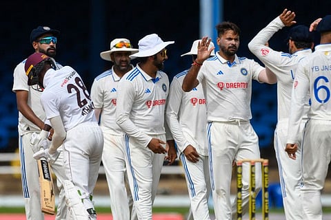 Team India celebrate a West Indies wicket during the fourth day of the second Test at Queen's Park Oval in Port of Spain on Sunday.