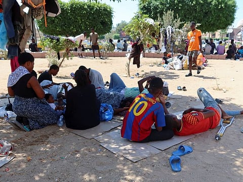 African migrants gather in a public garden in Sfax, Tunisia July 13, 2023.  