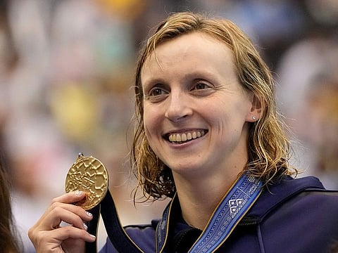 Gold medalist Katie Ledecky of United States holds her medal during ceremonies at women's 1500m freestyle finals at the World Swimming Championships in Fukuoka, Japan, Tuesday, July 25, 2023.