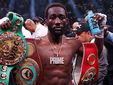 Terrence Crawford celebrates with the championship belt after defeating Errol Spence Jr. in the World Welterweight Championship bout/