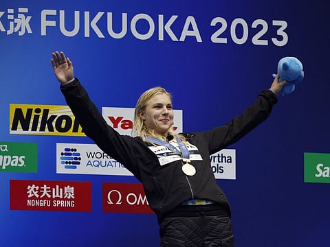 Lithuania's Ruta Meilutyte celebrates on the podium with the gold medal after winning the women's 50m breastroke final in the World Aquatics Championships in Fukuoka, Japan on Sunday.