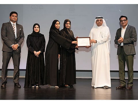 Ramkumar Thangaraj, Acting Consul General of India; Abdulla Lashkari Mohammad, Secretary-General of Permanent Committee of Labour Affairs in Dubai; and Jitendra Vaidya, President of the Indian People Forum, honouring representatives of the Dubai Foundation for Women and Children