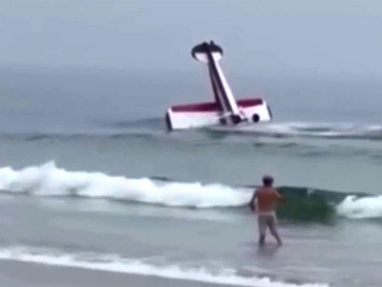 Video: New Hampshire beachgoers witness small plane crash into surf, flip in water