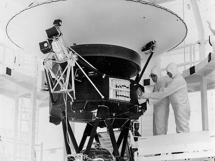  In this Aug. 4, 1977, photo provided by NASA, the "Sounds of Earth" record is mounted on the Voyager 2 spacecraft in the Safe-1 Building at the Kennedy Space Center, Fla., prior to encapsulation in the protective shroud. After days of silence, NASA has heard from Voyager 2, more than 12 billion miles away in interstellar space. Flight controllers accidentally sent a wrong command  nearly two weeks ago that tilted the spacecraft's antenna away from Earth and severed contact. The project manager said Tuesday, Aug. 1, 2023 that the fact that the Deep Space Network has picked up a “heartbeat signal” means the 46-year-old craft is alive and operating. 