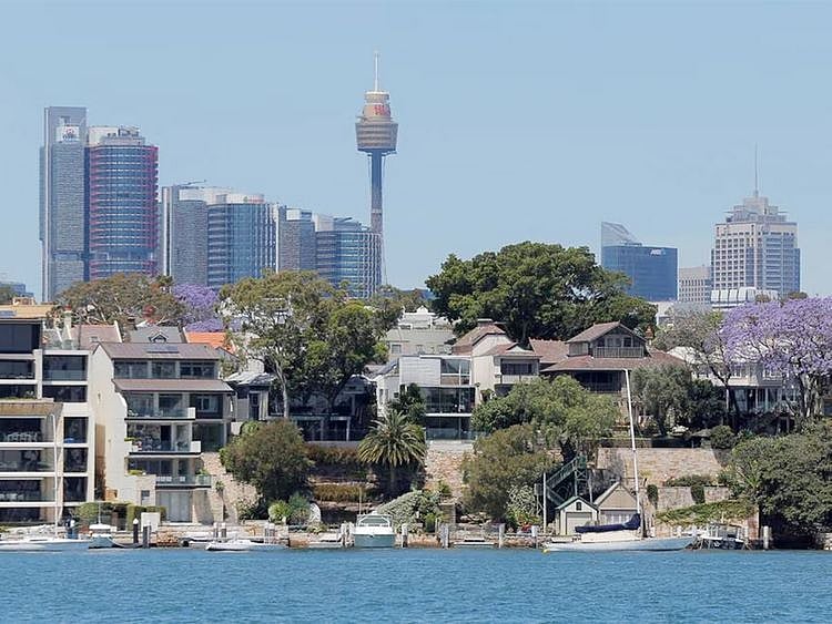 Sydney office buildings and commercial real estate appear behind Sydney waterfront properties