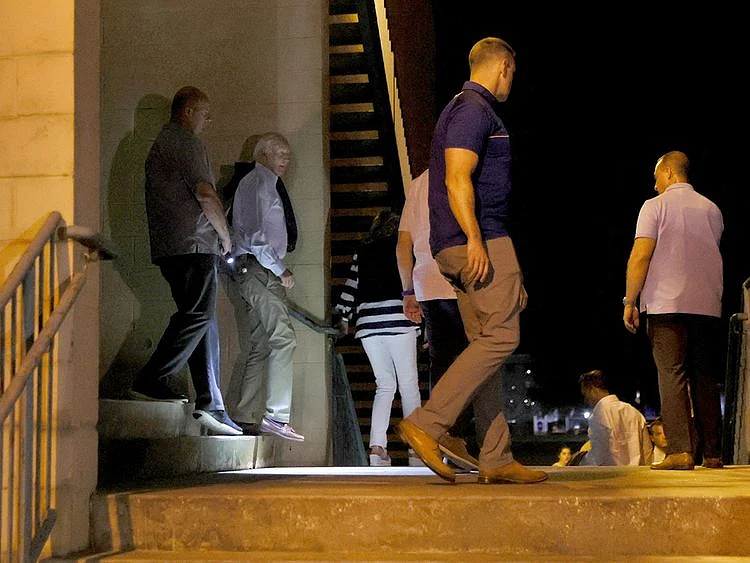 US President Joe Biden and first lady Jill Biden exit the Atlantic Theater