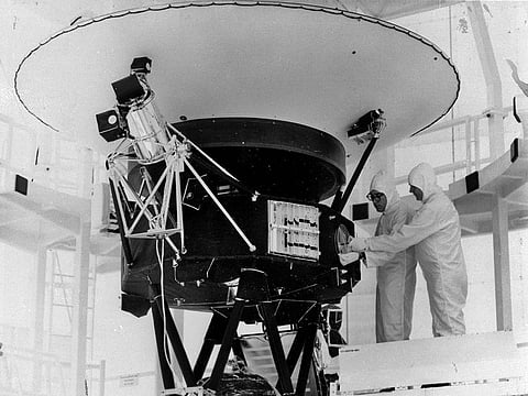 In this August 4, 1977, photo provided by NASA, the "Sounds of Earth" record is mounted on the Voyager 2 spacecraft in the Safe-1 Building at the Kennedy Space Center, Florida, prior to encapsulation in the protective shroud. NASA is listening for any peep from Voyager 2 after losing contact with the spacecraft billions of miles away. 