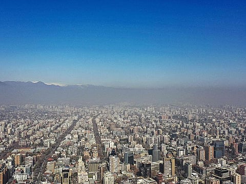 Aerial view of the city of Santiago showing the smog caused by high temperatures.