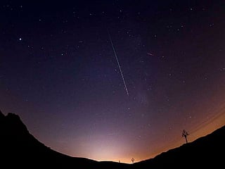 A streak of light seen above Mleiha, in Sharjah, UAE in 2022, which forms part of the annual Perseid meteor showers. 
