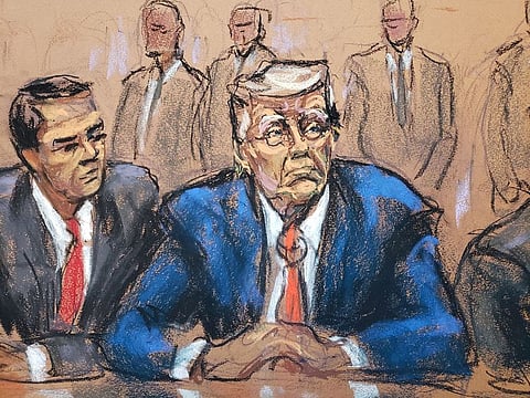 Former US President Donald Trump sits next to his attorney Todd Blanche as he faces charges before Magistrate Judge Moxila A. Upadhyaya that he orchestrated a plot to try to overturn his 2020 election loss, at federal court in Washington, on August 3, 2023 in a courtroom sketch.  