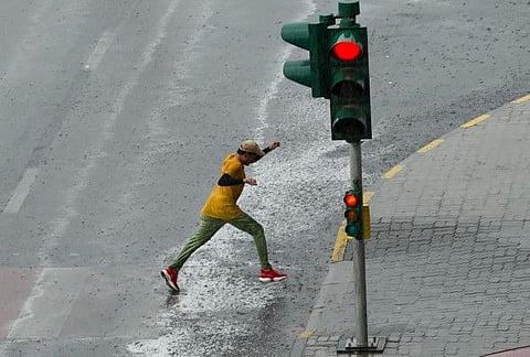 In photos: UAE residents go about their day amid heavy rains in Dubai and Sharjah 