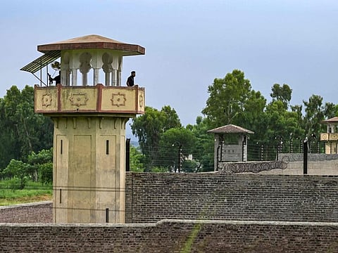 Policemen stand guard at the Attock prison post where Pakistan's former Prime Minister Imran Khan is being held on August 6, 2023.  