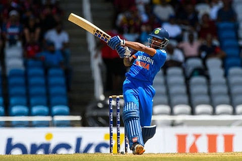Tilak Varma of India takes the aerial route during the first T20I match against West Indies at Brian Lara Cricket Academy in Tarouba, Trinidad and Tobago, on August 3.