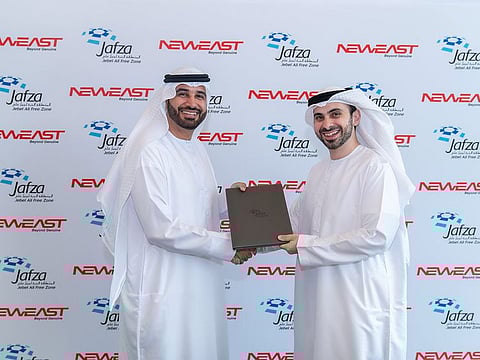 Henry Shaaya, Managing Director of Neweast General Trading and Abdulla Al Hashmi, COO of Parks and Zones, DP World UAE sign lease agreement to establish auto spare parts hub.