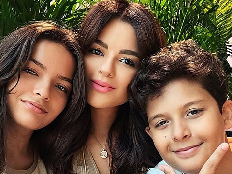 Sarah Abdallah, is a Dubai-based social media influencer, seen here with her two children, Olivia (left) and Christian (right). 