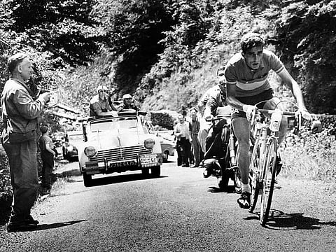 File photo: Spanish cyclist Federico Bahamontes climbs the hill during the 15th stage of the Tour de France, between Lunchon and Toulouse, on July, 11, 1958. 