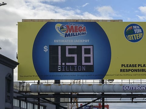An electronic billboard displays the Mega Millions lottery jackpot at $1.58 billion, in New York City on August 08, 2023.  