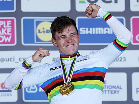 Remco Evenepoel celebrates winning the men's Individual Time Trial in Stirling during the UCI Cycling World Championships in Scotland on August 11, 2023. 