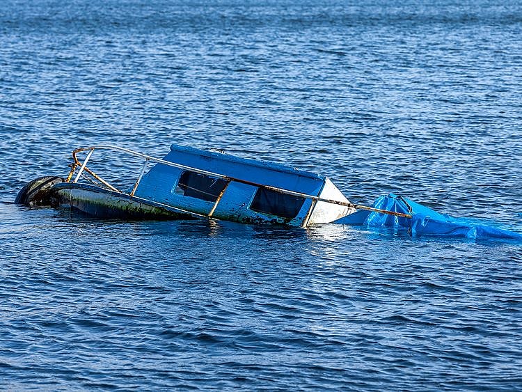 Boat capsizes