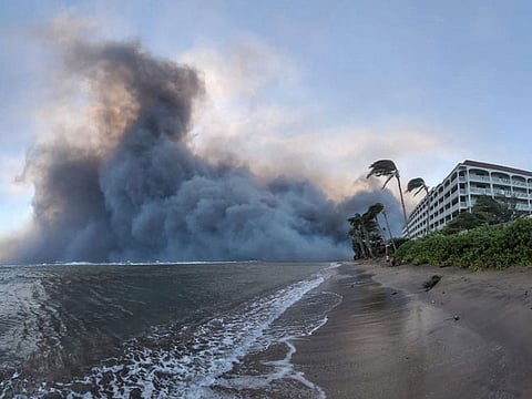 Smoke billows near Lahaina as wildfires driven by high winds destroy a large part of the historic town of Lahaina, in Kahului, Hawaii.