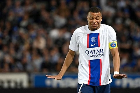 Paris Saint-Germain's French forward Kylian Mbappe reacts during the French L1 match against RC Strasbourg Alsace at Stade de la Meinau in Strasbourgin May.