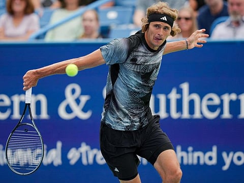Alexander Zverev of Germany returns a shot to Grigor Dimitrov of Bulgaria during their third-round match at the Western & Southern Open at Lindner Family Tennis Centre on Tuesday.