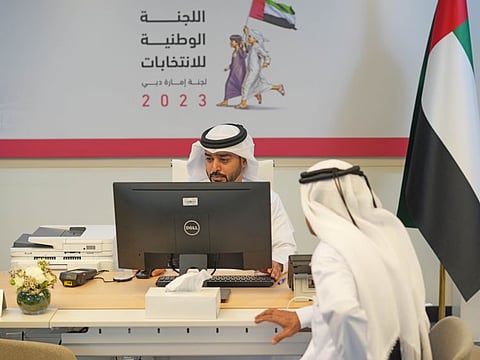 An applicant (right) registers for candidacy for membership to the Federal National Council, at Dubai World Trade Centre on Tuesday, the first day of the registration process