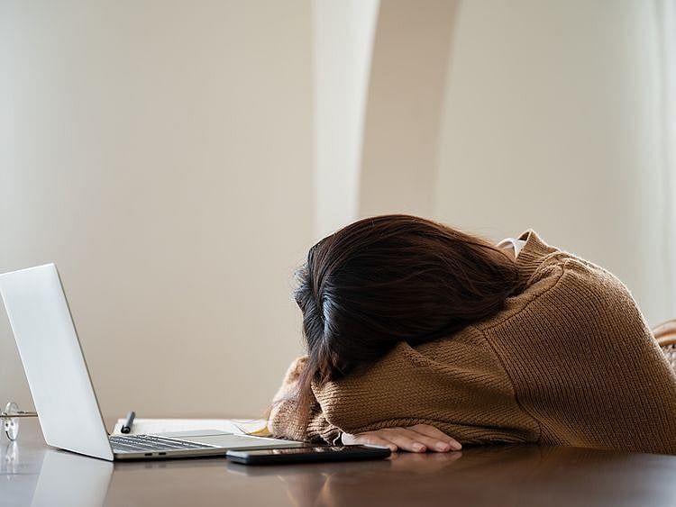 Exhausted person at the workplace
