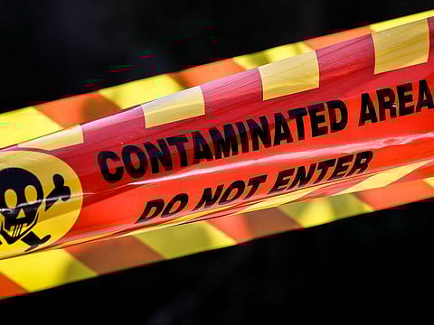 Tape surrounds a building after the Australian Border Force raided an apartment block amid media reports 'nuclear isotopes' had been found