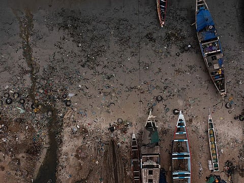 File photo: Open sewage flows to the ocean next to traditional boats known as pirogues at the Yarakh Beach in Dakar, Senegal.