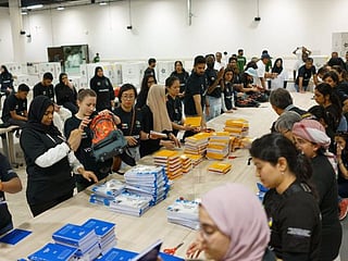 Volunteers in UAE pack school kits for 7,000 children in need