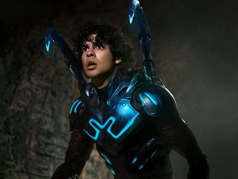 A still of 'Blue Beetle' featuring Xolo Mariduena as the Latino superhero