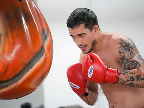 Biaggio Ali Walsh hits a punching bag while training ahead of his return to the Professional Fighters League.