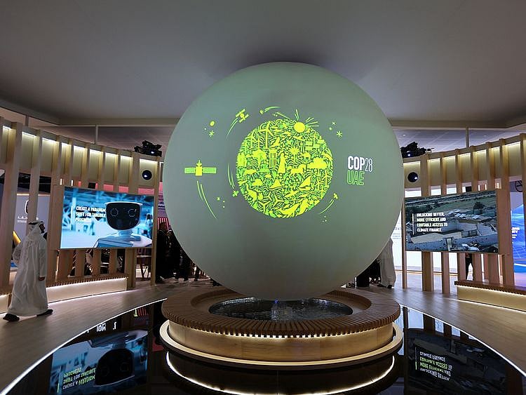 Archive image of the COP28 logo on a display during the Abu Dhabi Sustainability Week in January 