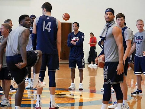 USA team head coach Steve Kerr, right, and assistant coach Erik Spoelstra, center, gather their players during a practice session ahead of the Basketball World Cup in Taguig.