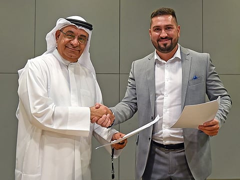 (L) Abdul Hamid Ahmad, CEO and Editor-in-Chief of Gulf News and (R) Vitalii Mykhalchuk, CEO of Amsaan-Video Relay Service.
