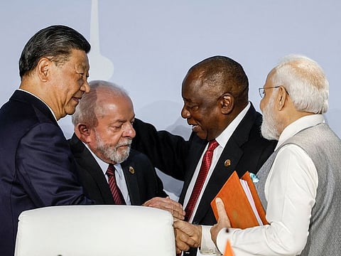 (From L to R) President of China Xi Jinping, President of Brazil Luiz Inacio Lula da Silva, South African President Cyril Ramaphosa and Prime Minister of India Narendra Modi gesture during the 2023 BRICS Summit.