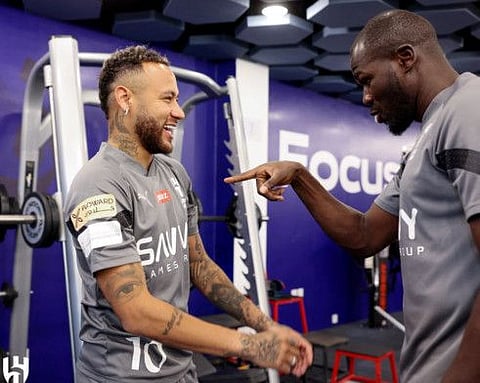 Al Hilal's Neymar and Kalidou Koulibaly chat during a training session at Al Hilal Football Club, Riyadh, Saudi Arabia.