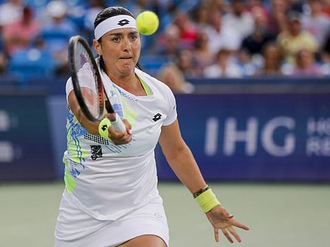 Ons Jabeur of Tunisia plays a forehand against Aryna Sabalenka during the Western and Southern Open tournament at Lindner Family Tennis Centre.