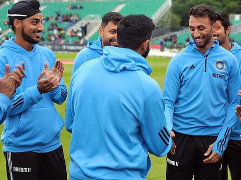 File photo: India's Prasidh Krishna receives his debut T20I cap from captain Jasprit Bumrah ahead of 1st T20I against Ireland, at The Village, in Dublin on August 18, 2023. 