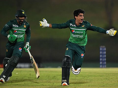 Pakistan's Naseem Shah (right) and Haris Rauf celebrate after Pakistan won by one wicket during the second ODI at the Mahinda Rajapaksa International Cricket Stadium in Hambantota on Friday