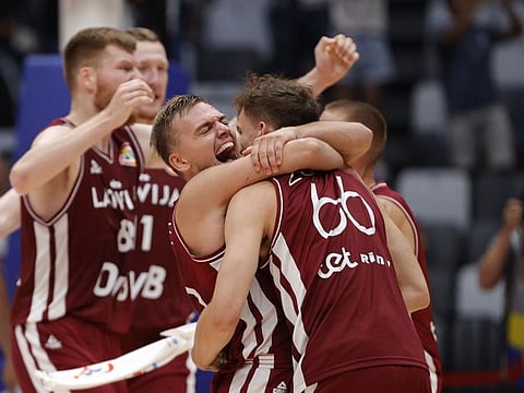 Latvia's Kristers Zoriks celebrate with teammates after the Group H match against France at the Indonesia Arena, Jakarta on Sunday.
