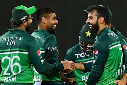Pakistan's captain Babar Azam (second from left) celebrates with teammates after the dismissal of Afghanistan's Hashmatullah Shahidi during the third and final ODI at the R. Premadasa Stadium in Colombo on August 26.