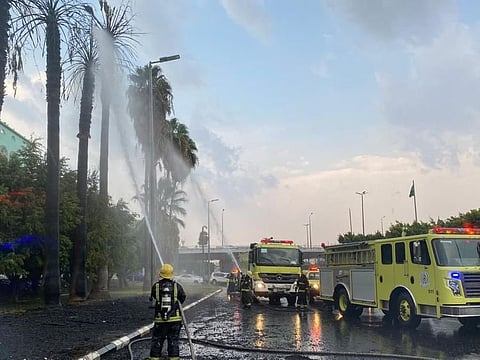 Saudi firemen put out a blaze that hit palm trees in Taif.  