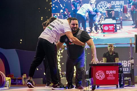 Jordan’s Abdelkareem Khattab celebrates his world record show with coach in Dubai on Wednesday.