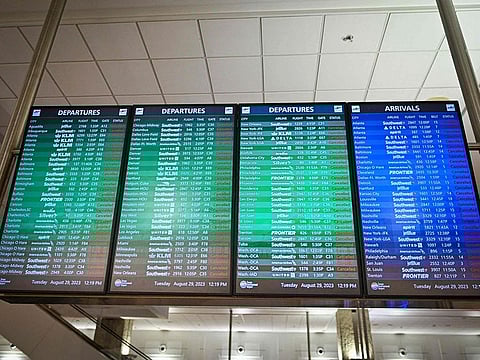 A sign shows all flights cancelled at the closed Tampa International Airport in Tampa, Florida.