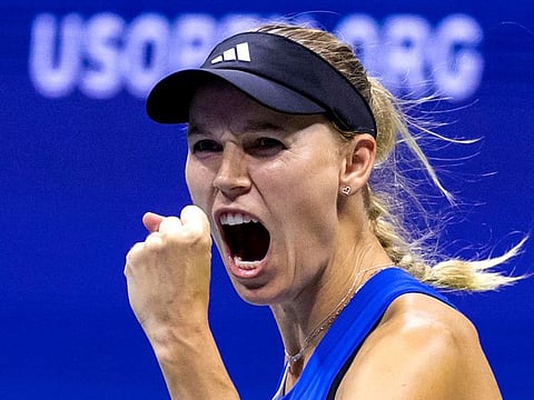 Denmark's Caroline Wozniacki reacts after wining a point won against Czech Republic's Petra Kvitova during the US Open second round.