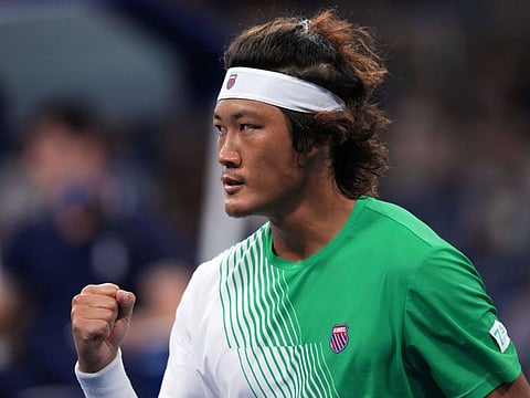 Zhang Zhizhen of China has a muted celebration after winning a point against Casper Ruud at Flushing Meadows on Wednesday.